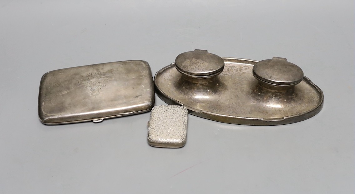 A George V silver double oval inkwell, with engraved inscription, Birmingham, 1913, 20.3cm, a silver cigarette case and a small late Victorian silver purse.